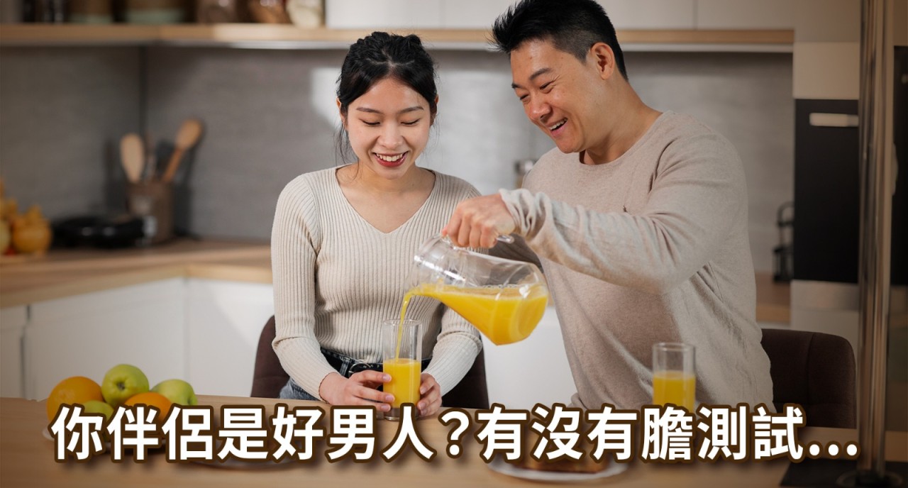 Man pouring orange juice for partner